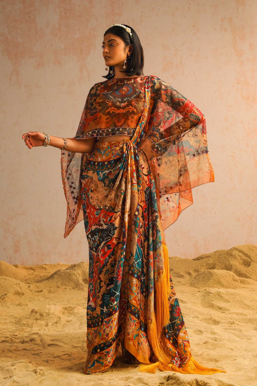Mustard yellow draped saree with blouse and cape