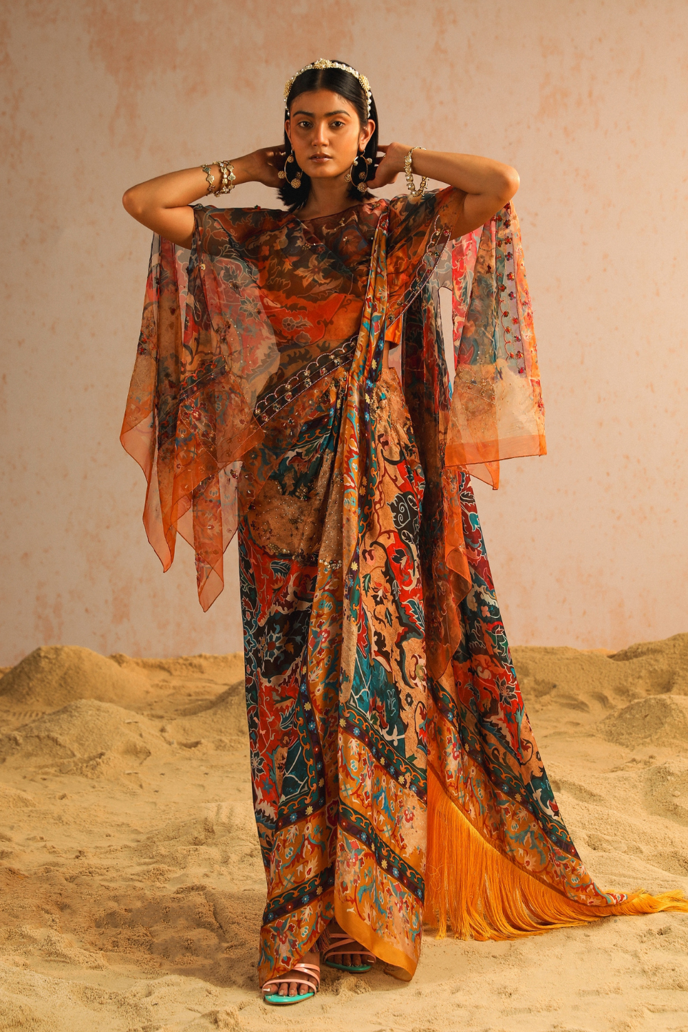 Mustard yellow draped saree with blouse and cape