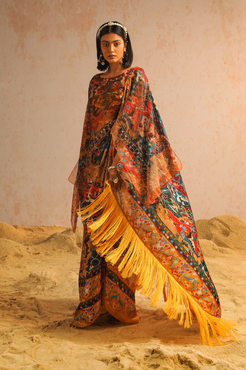 Mustard yellow draped saree with blouse and cape