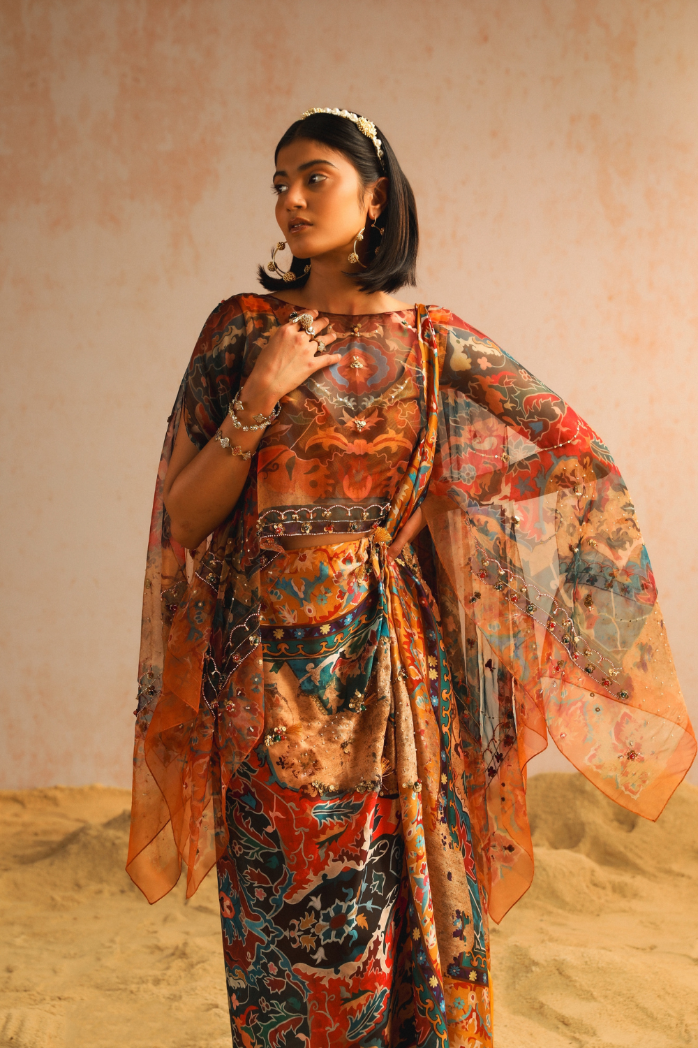 Mustard yellow draped saree with blouse and cape
