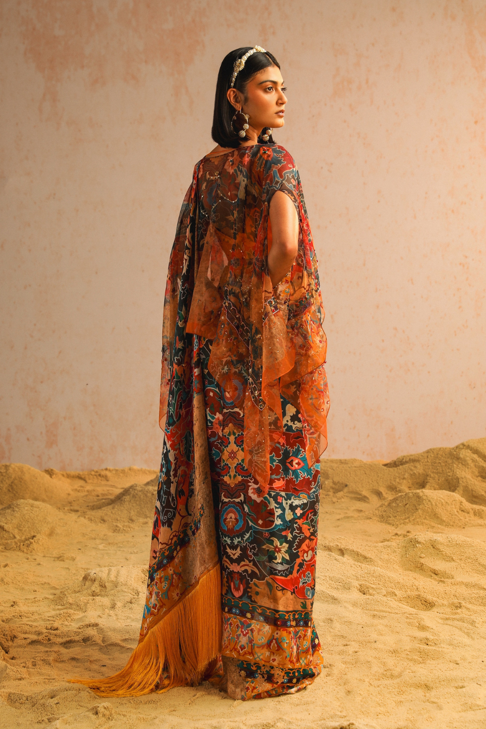 Mustard yellow draped saree with blouse and cape