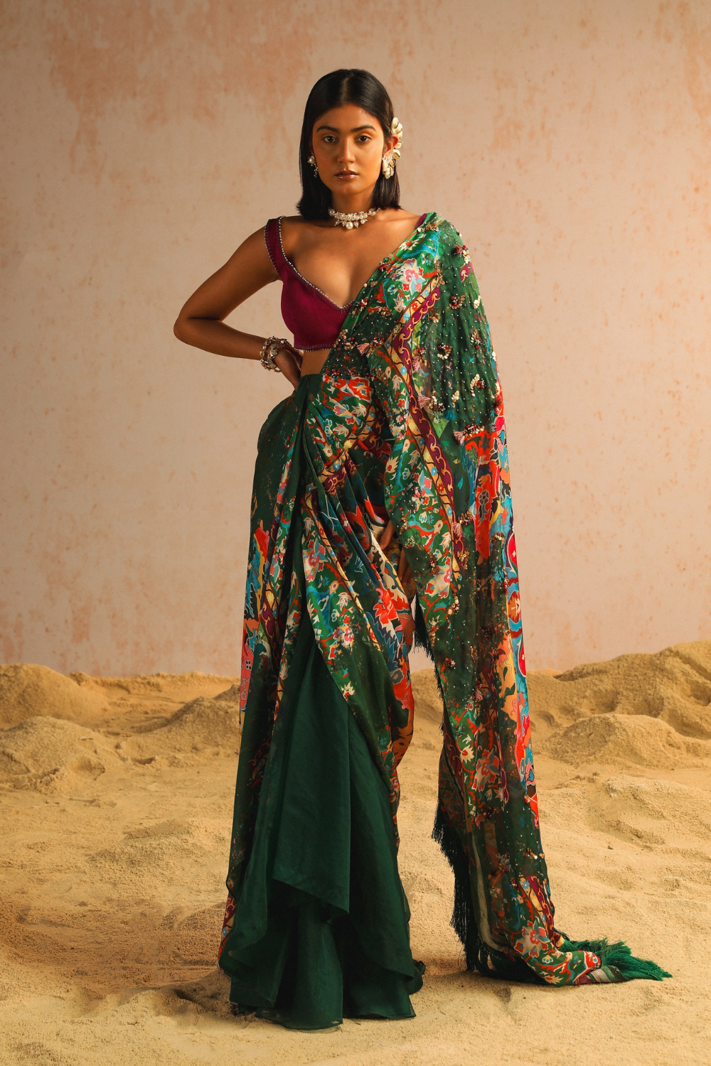 Green draped saree with purple blouse