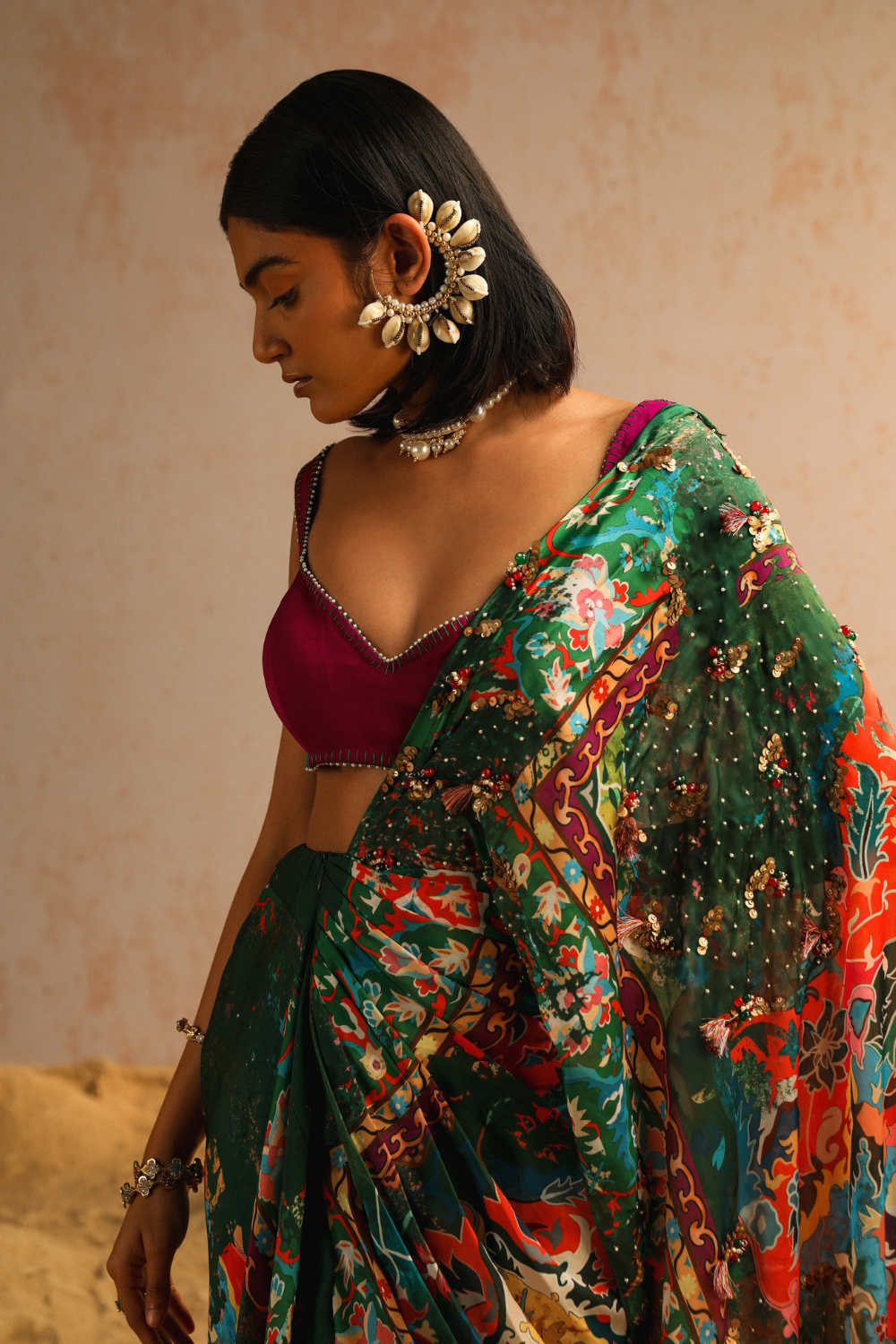 Green draped saree with purple blouse