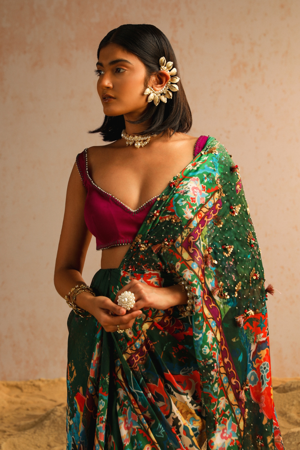 Green draped saree with purple blouse