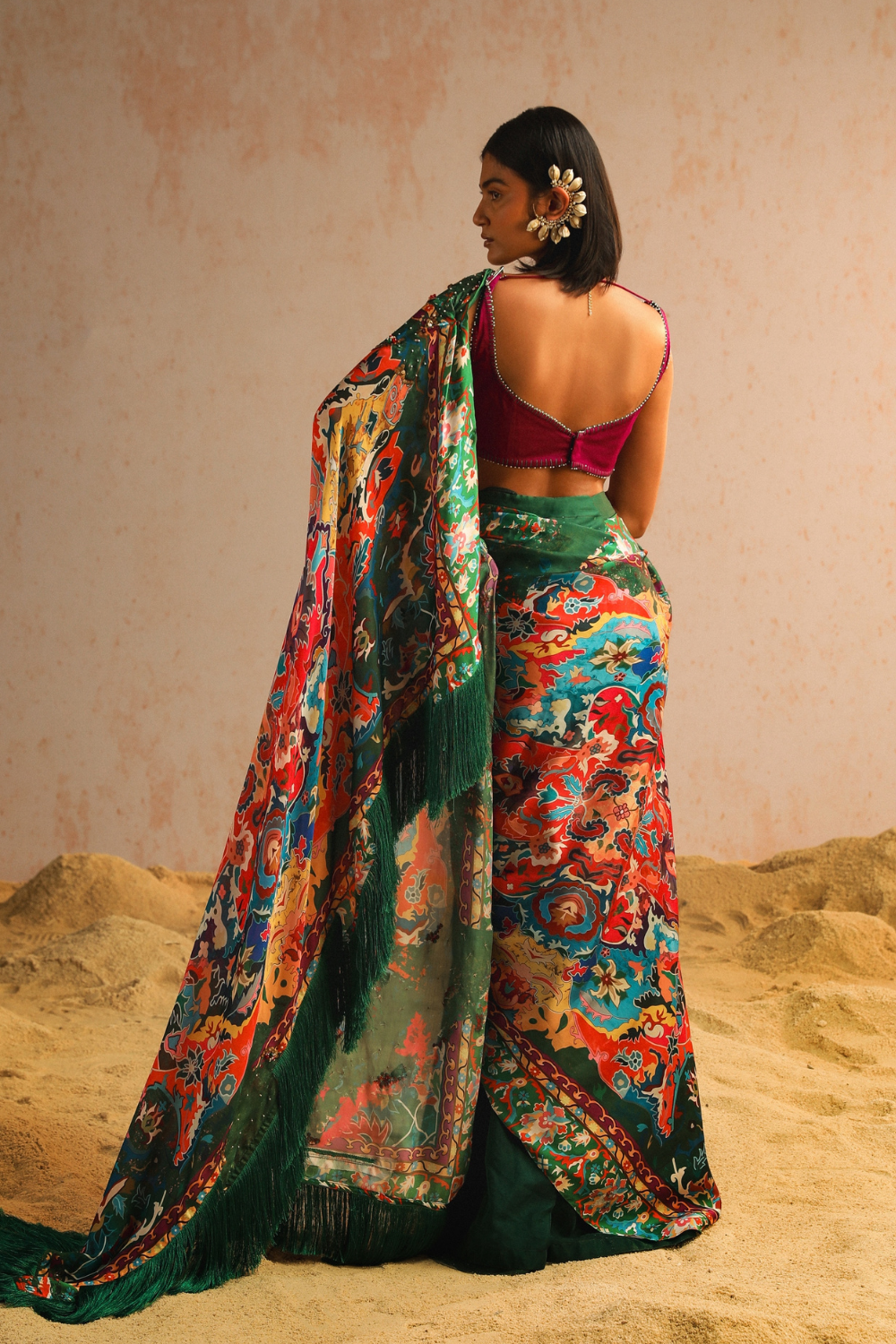 Green draped saree with purple blouse