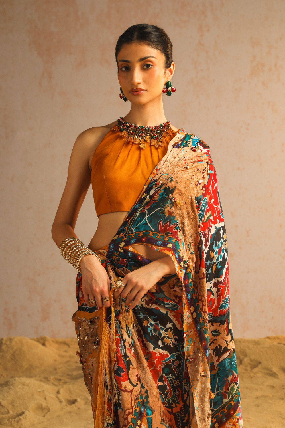 Mustard yellow draped saree with halter neck blouse