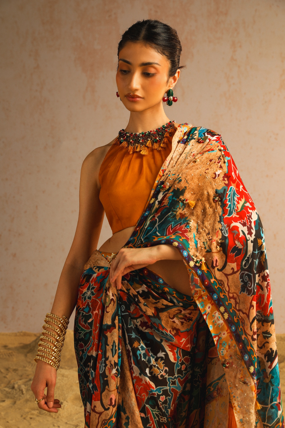 Mustard yellow draped saree with halter neck blouse