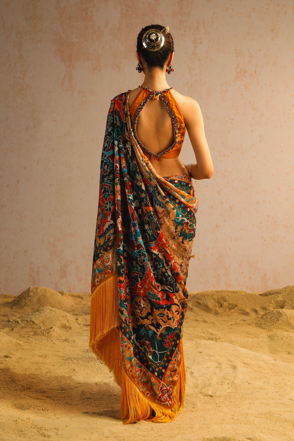 Mustard yellow draped saree with halter neck blouse