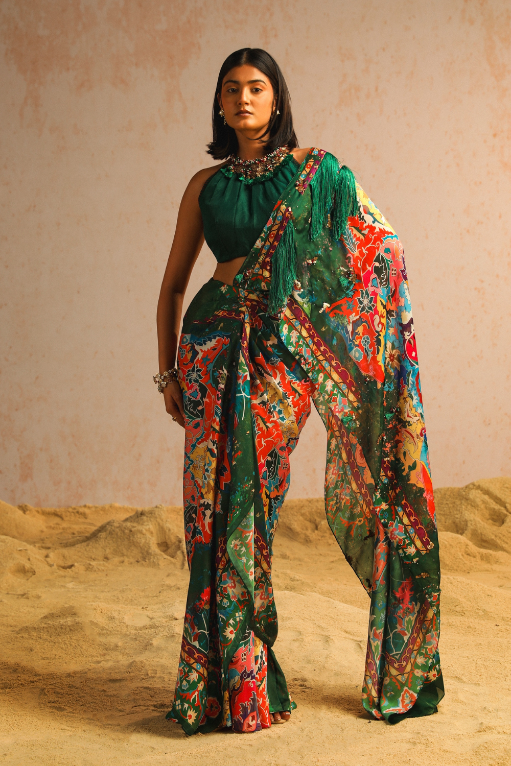 Green draped saree with haulter neck blouse