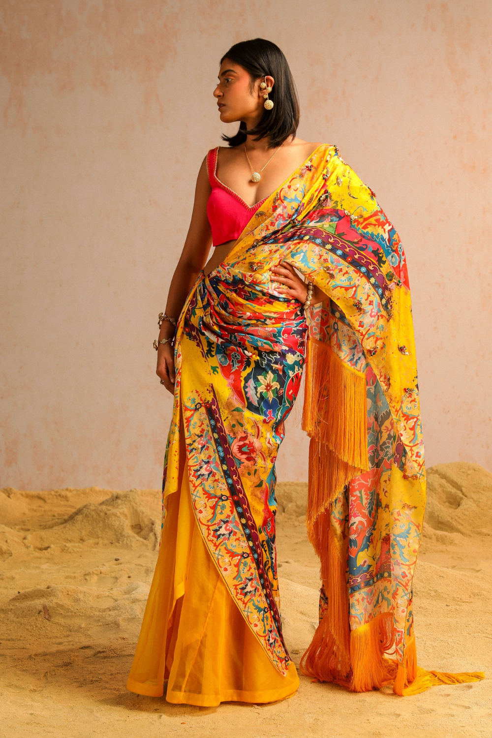 Yellow draped saree with hot pink blouse