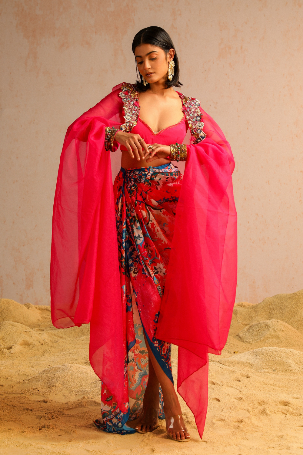 Hot pink draped skirt with blouse and cape