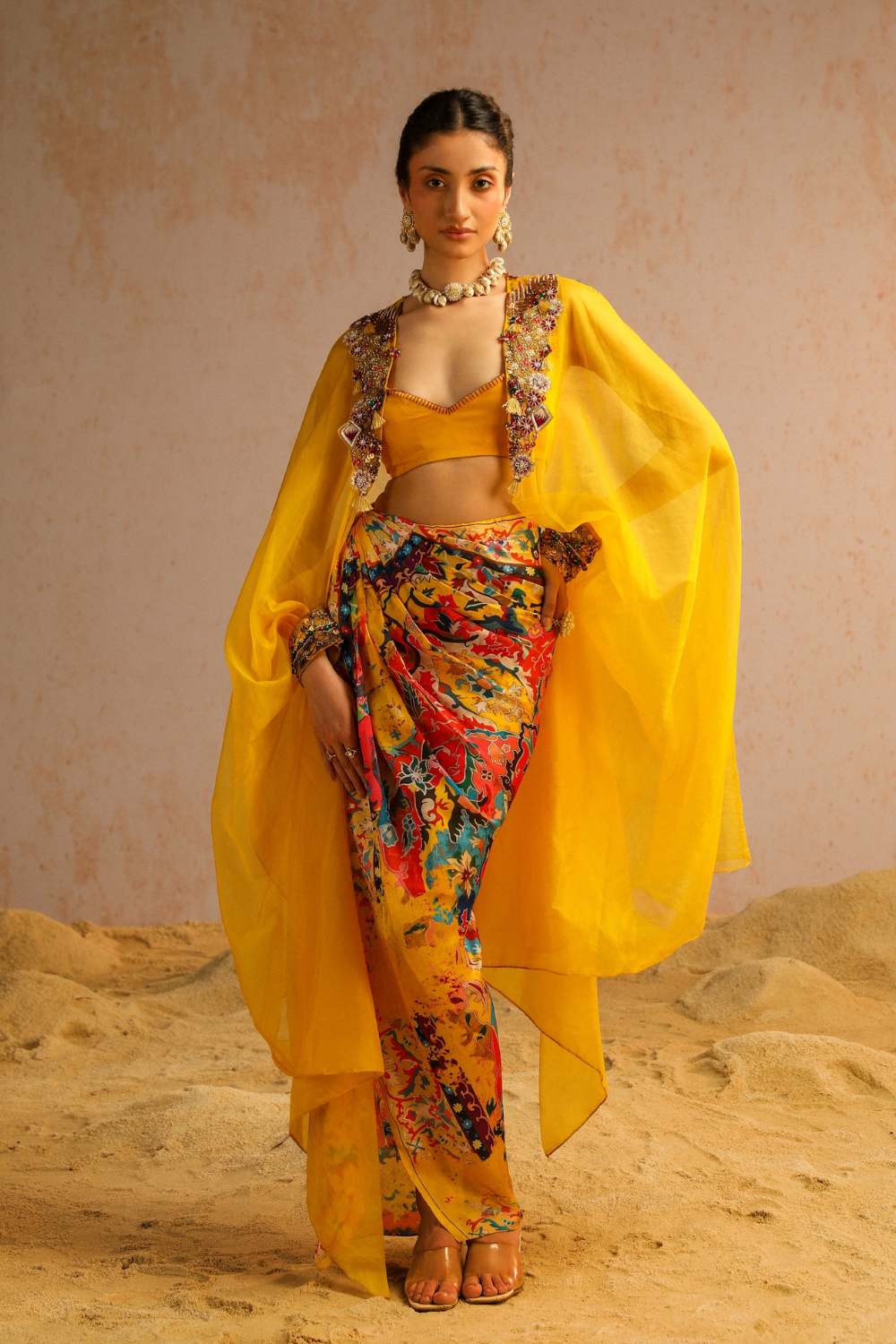 Yellow draped skirt with blouse and cape