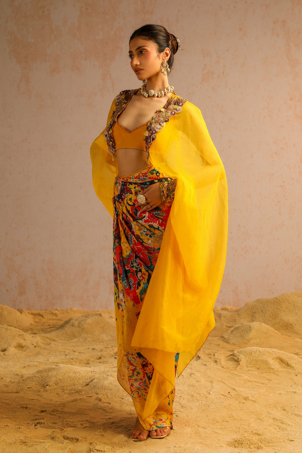 Yellow draped skirt with blouse and cape