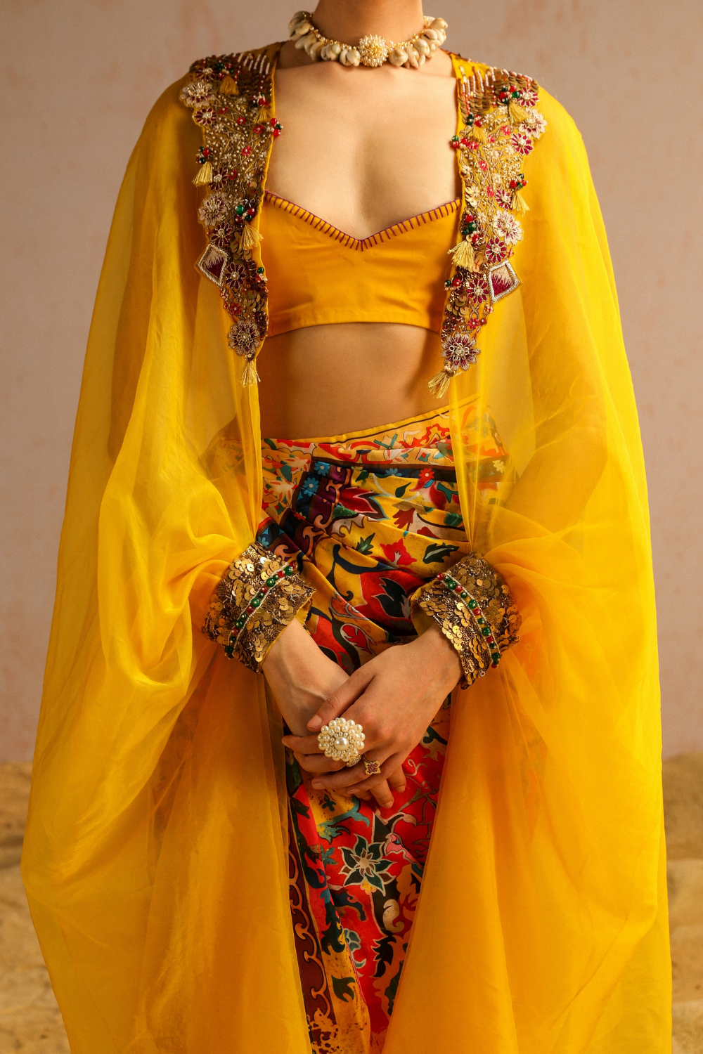 Yellow draped skirt with blouse and cape