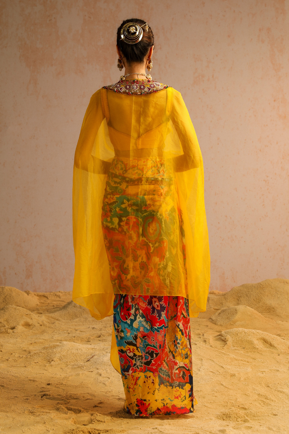 Yellow draped skirt with blouse and cape