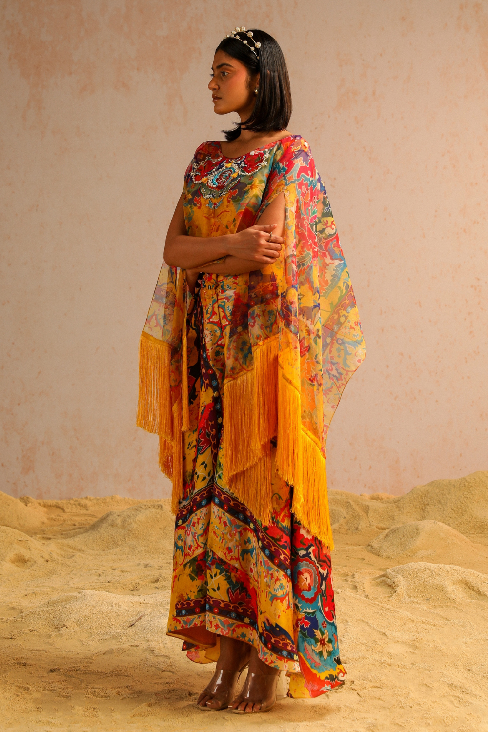 Yellow pants with blouse and cape