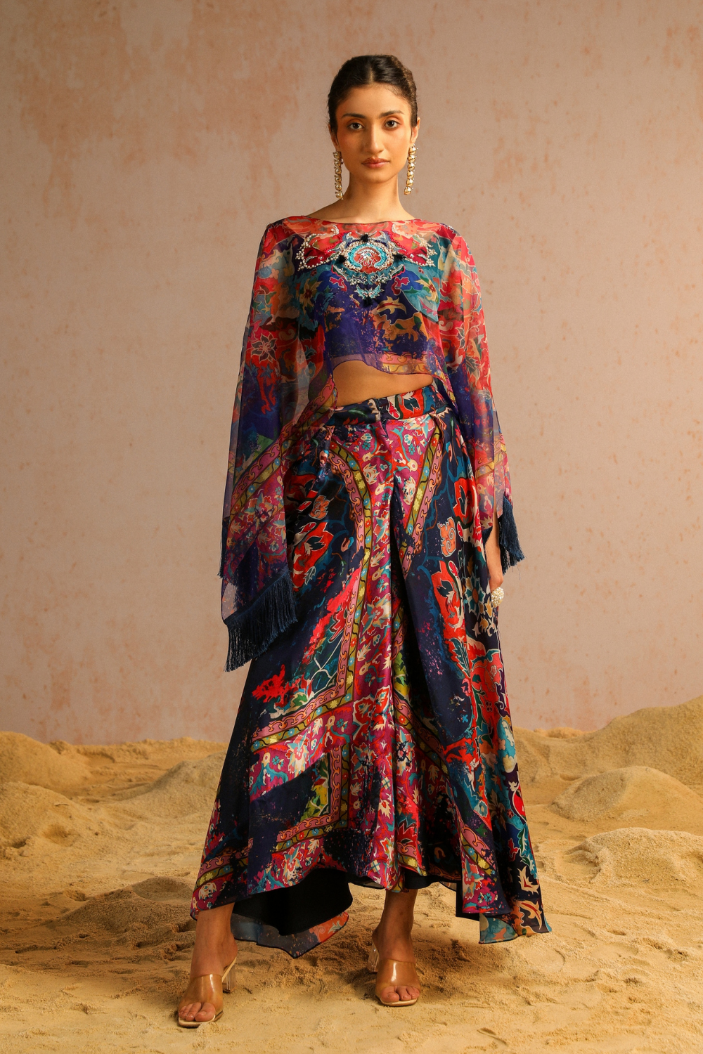 Blue pants with blouse and cape