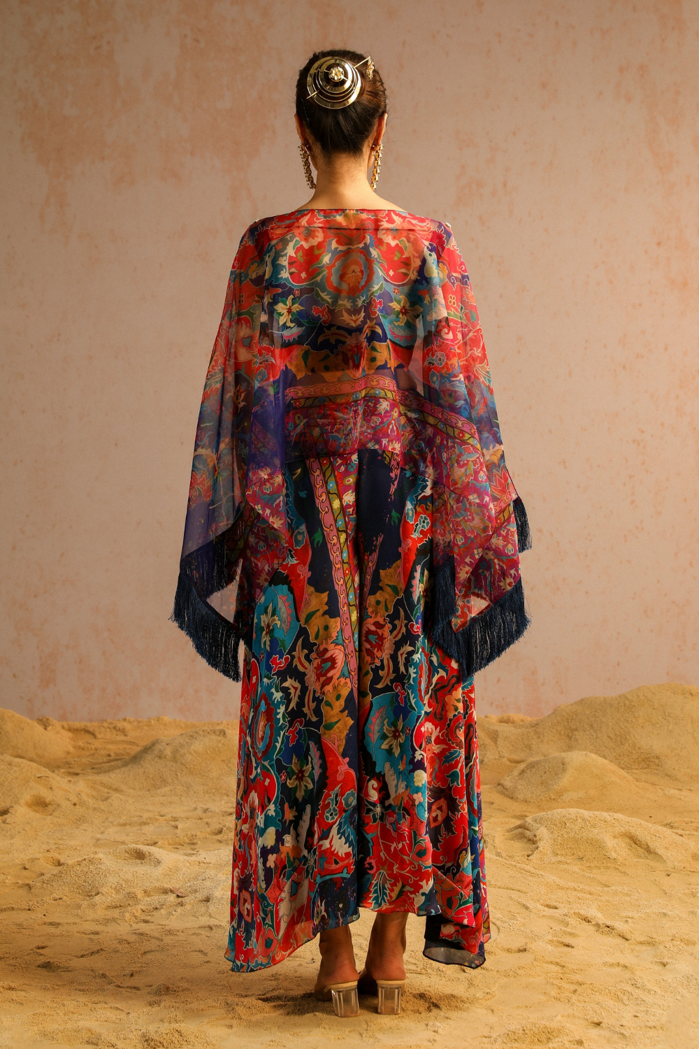 Blue pants with blouse and cape