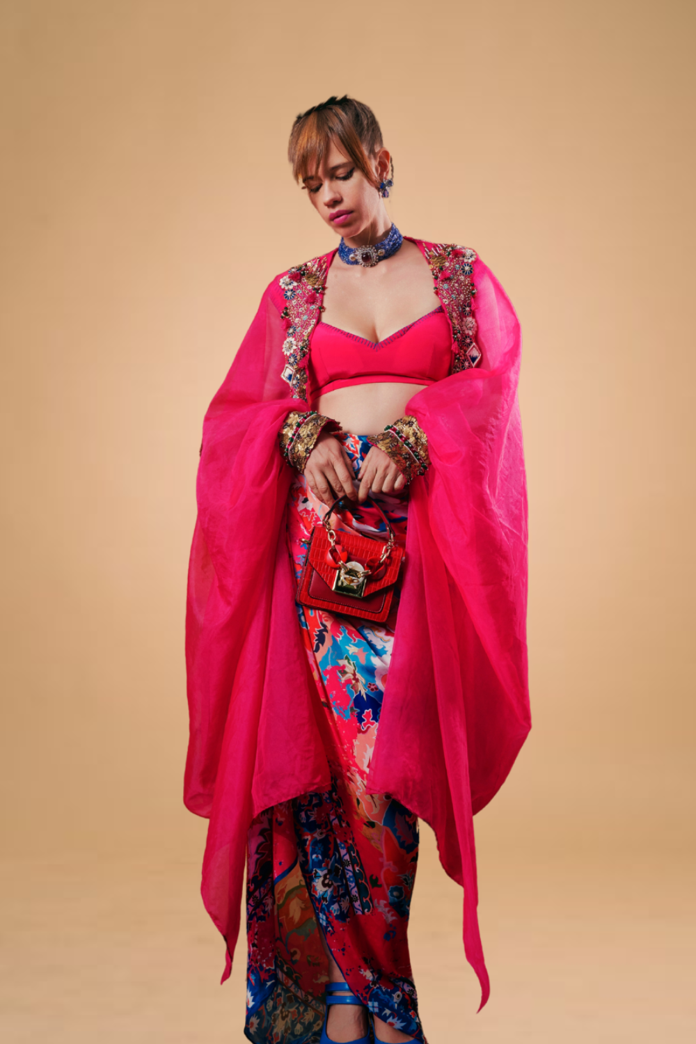 Kalki Koechlin in Hot pink draped skirt with blouse & cape
