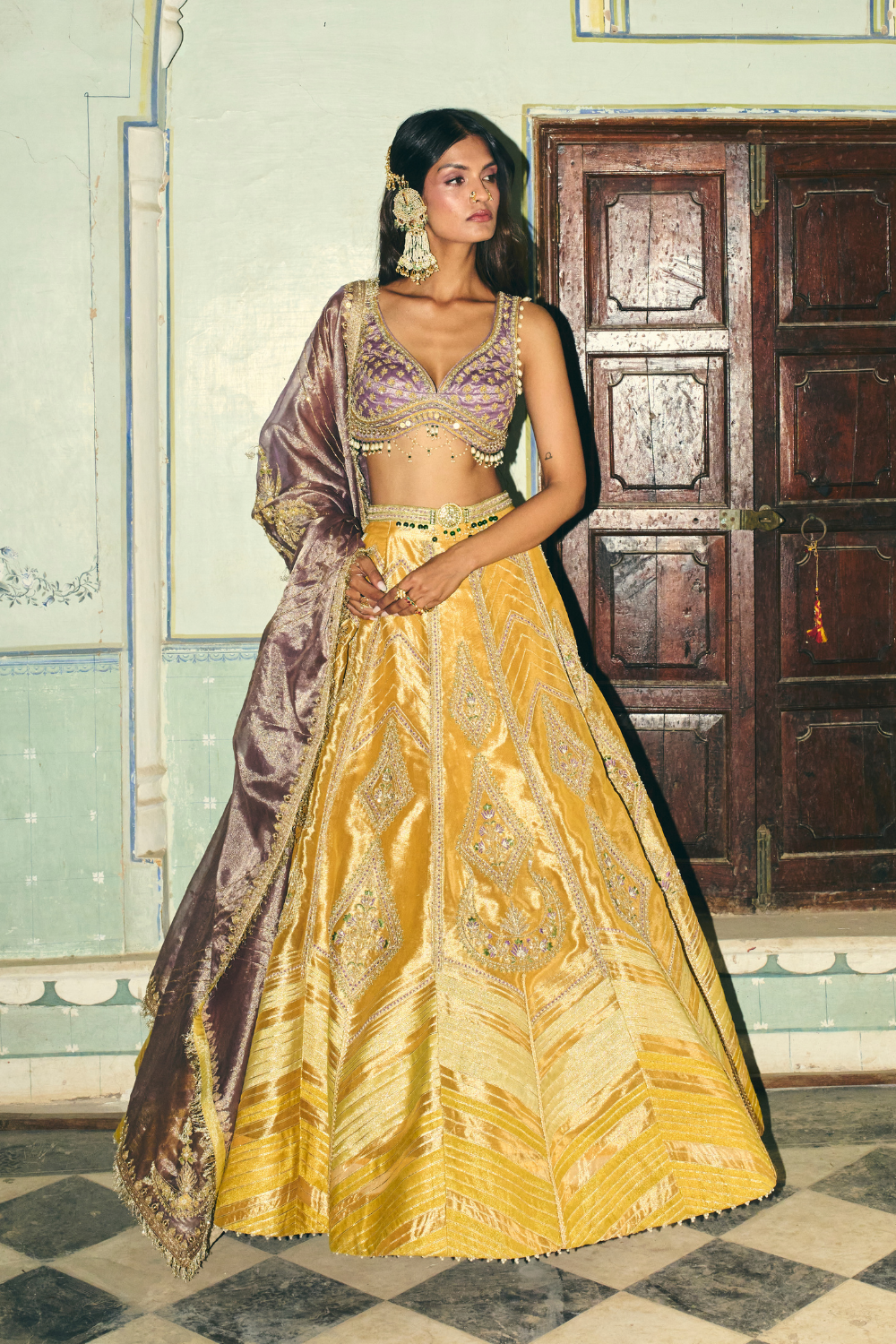 Saiee Manjrekar in our Mustard yellow with lilac tissue dupatta lehenga set