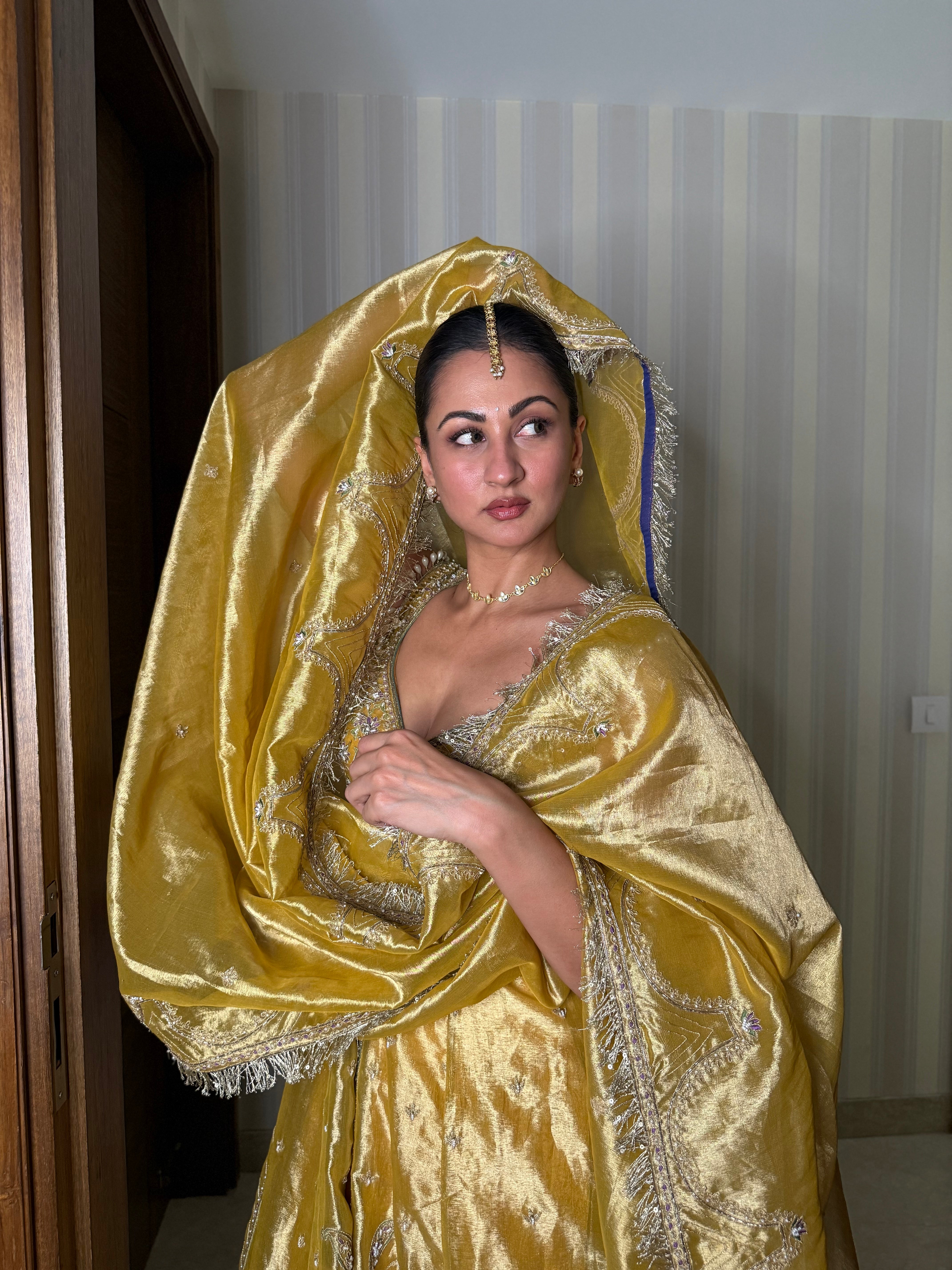 Sukhneett Wadhwa in our Mustard yellow zari tissue jacket with crushed skirt set