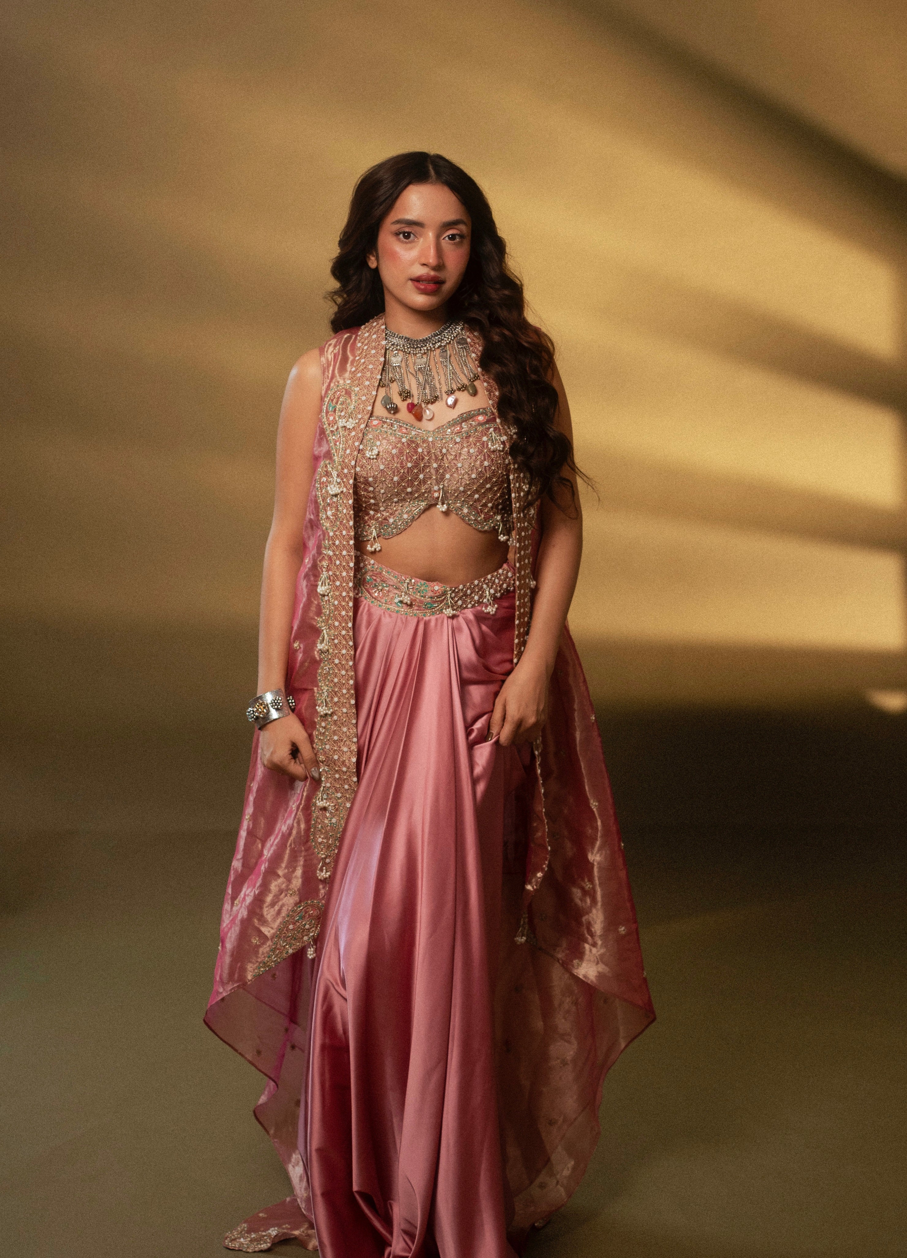 Diksha Rawat in our Blush pink drape satin skirt set with cape