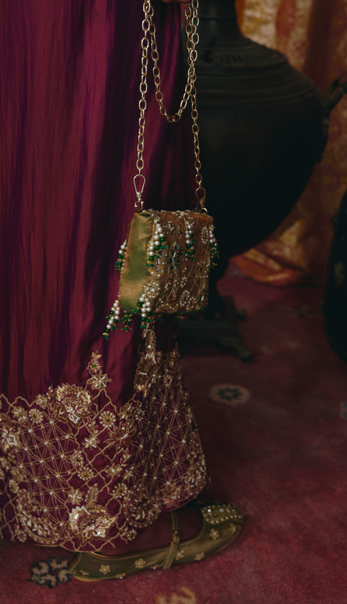 Emerald green tissue sling bag