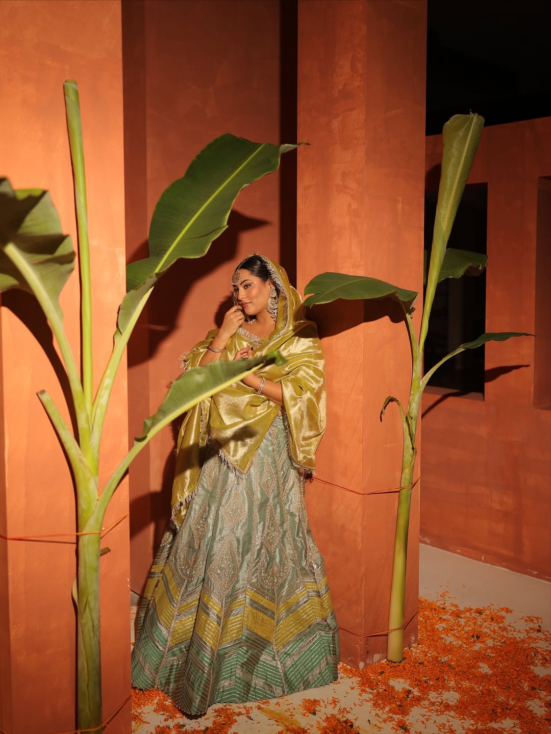 Sakshi Sindhvani in our Ice blue silk zari tissue lehenga with olive bloom dupatta