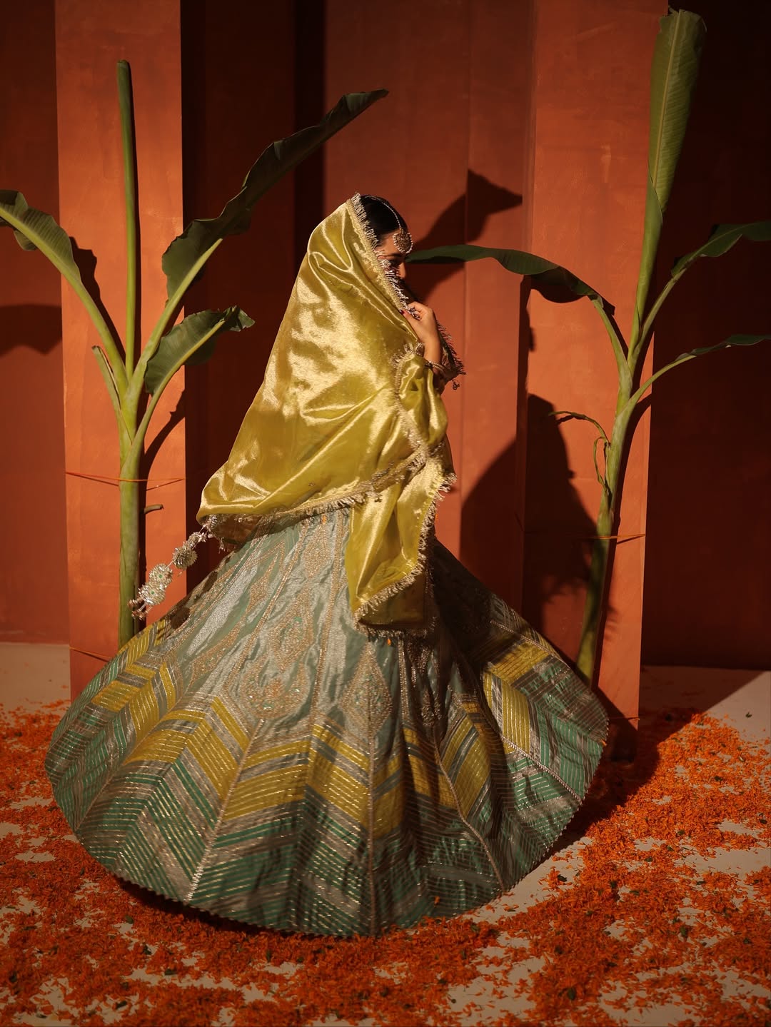 Sakshi Sindhvani in our Ice blue silk zari tissue lehenga with olive bloom dupatta