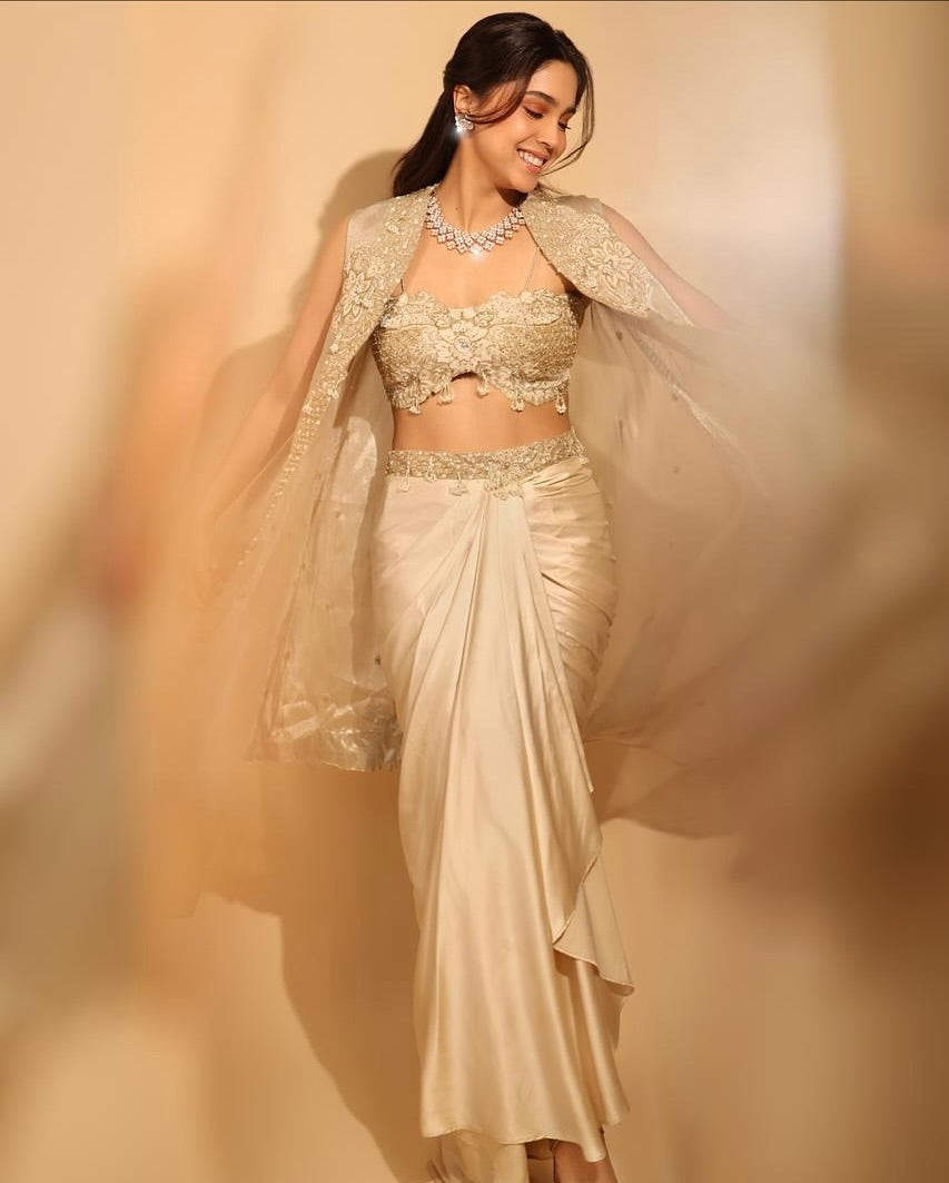 Sharvari in our Champagne gold drape satin skirt with cape