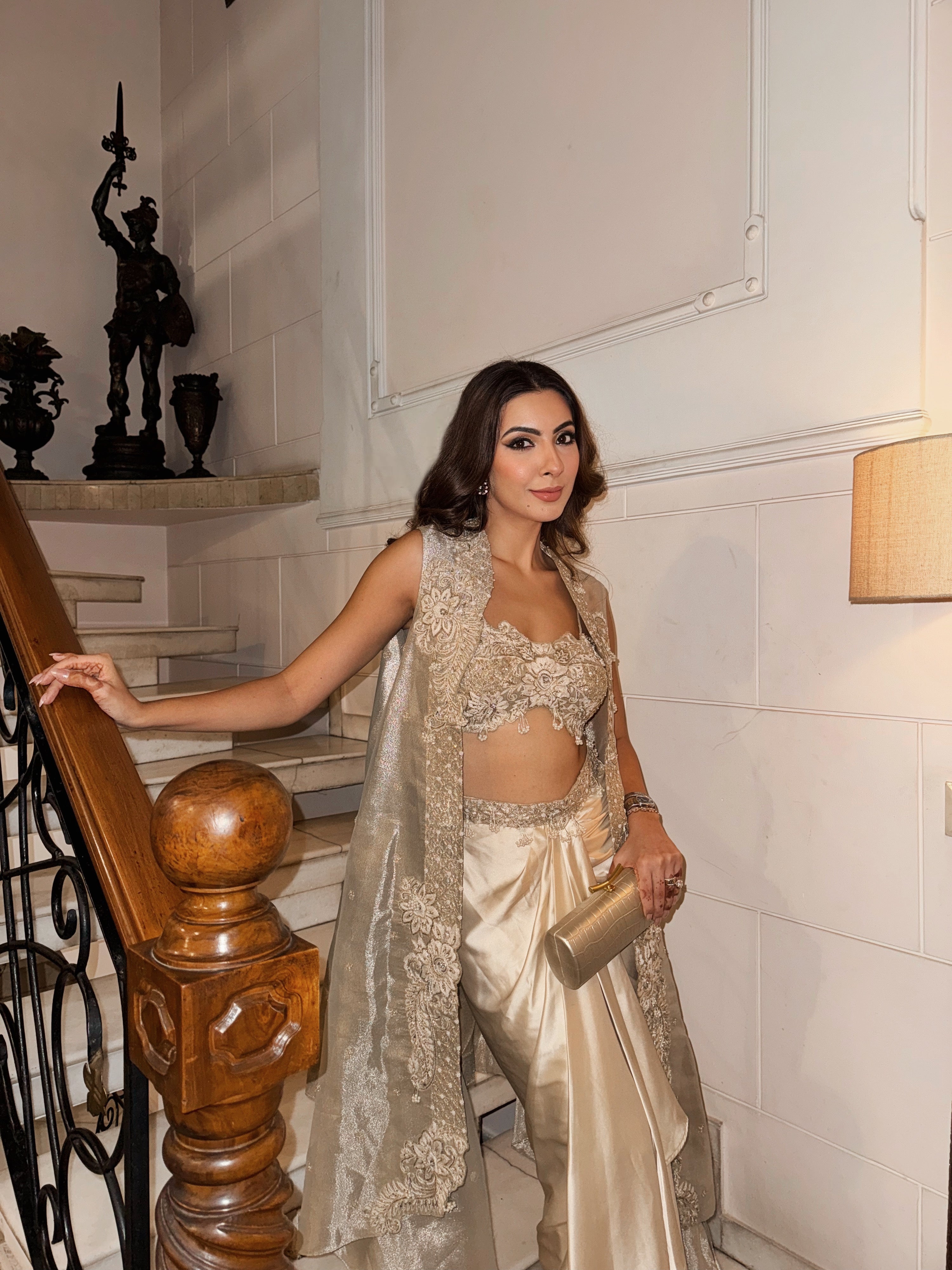 Nikki Mehra in our Champagne gold drape satin skirt with cape