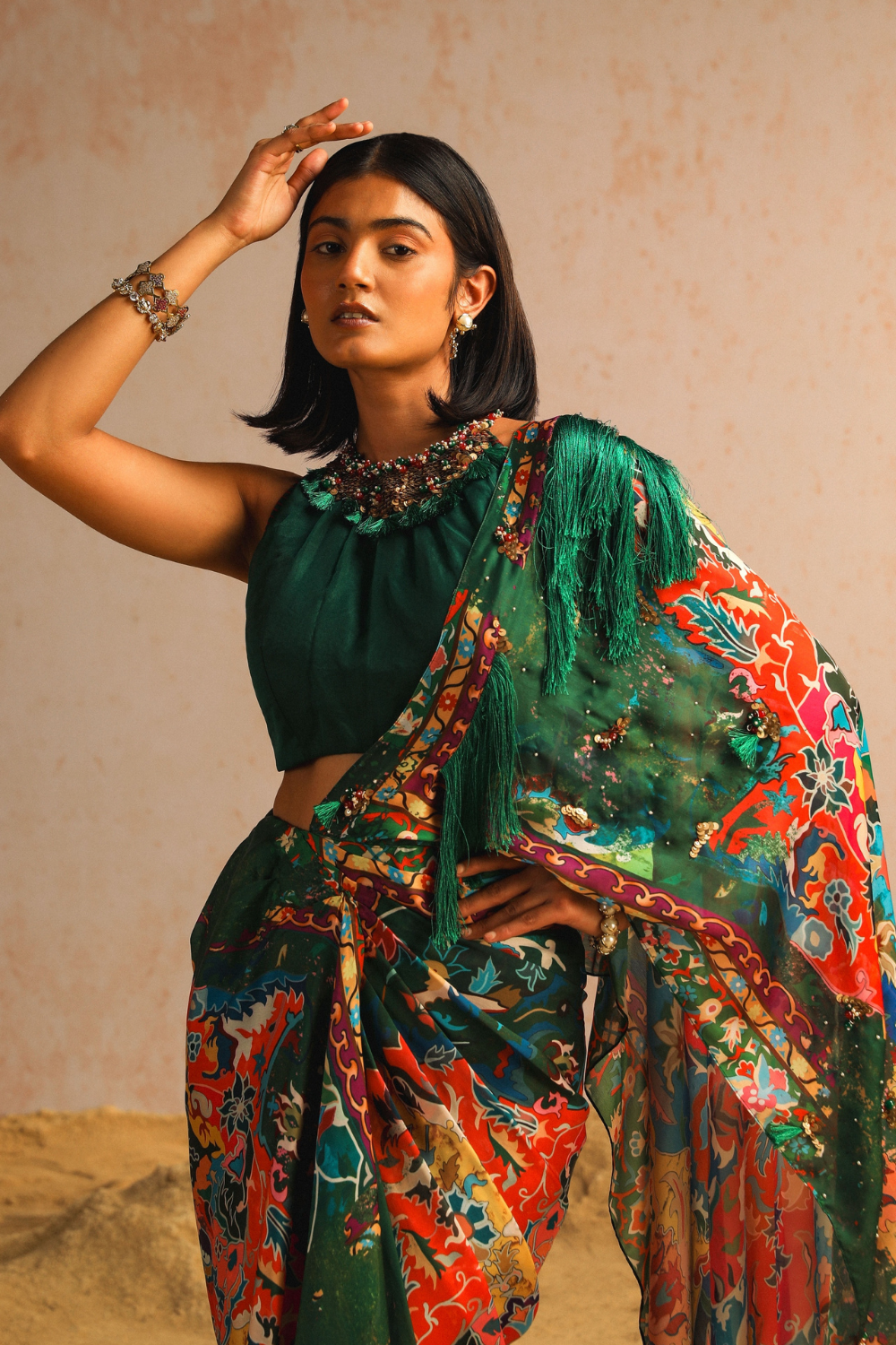 Green draped saree with haulter neck blouse