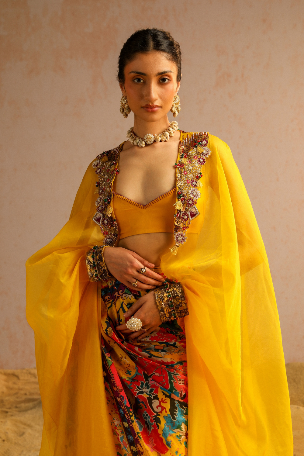 Yellow draped skirt with blouse and cape