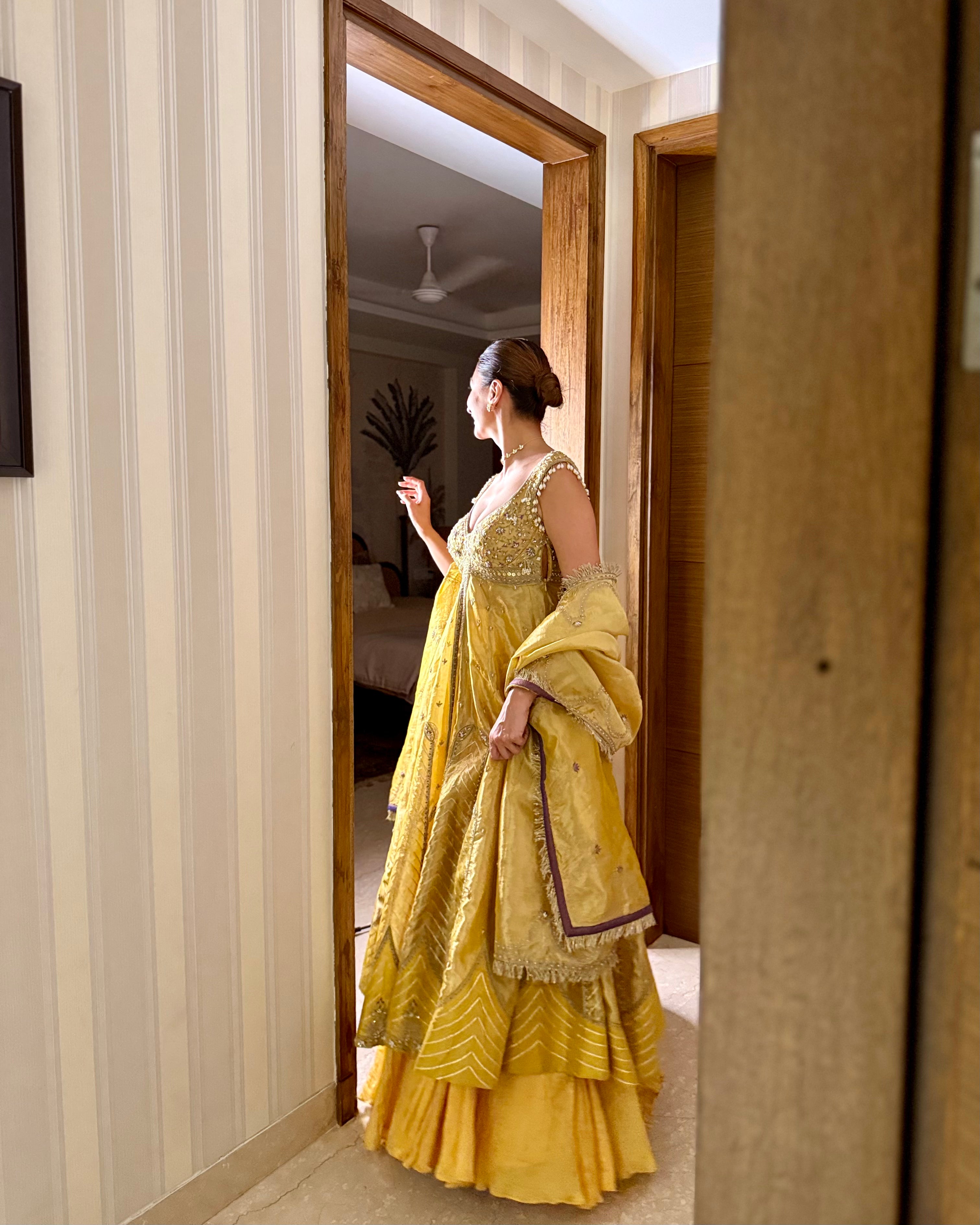 Sukhneett Wadhwa in our Mustard yellow zari tissue jacket with crushed skirt set