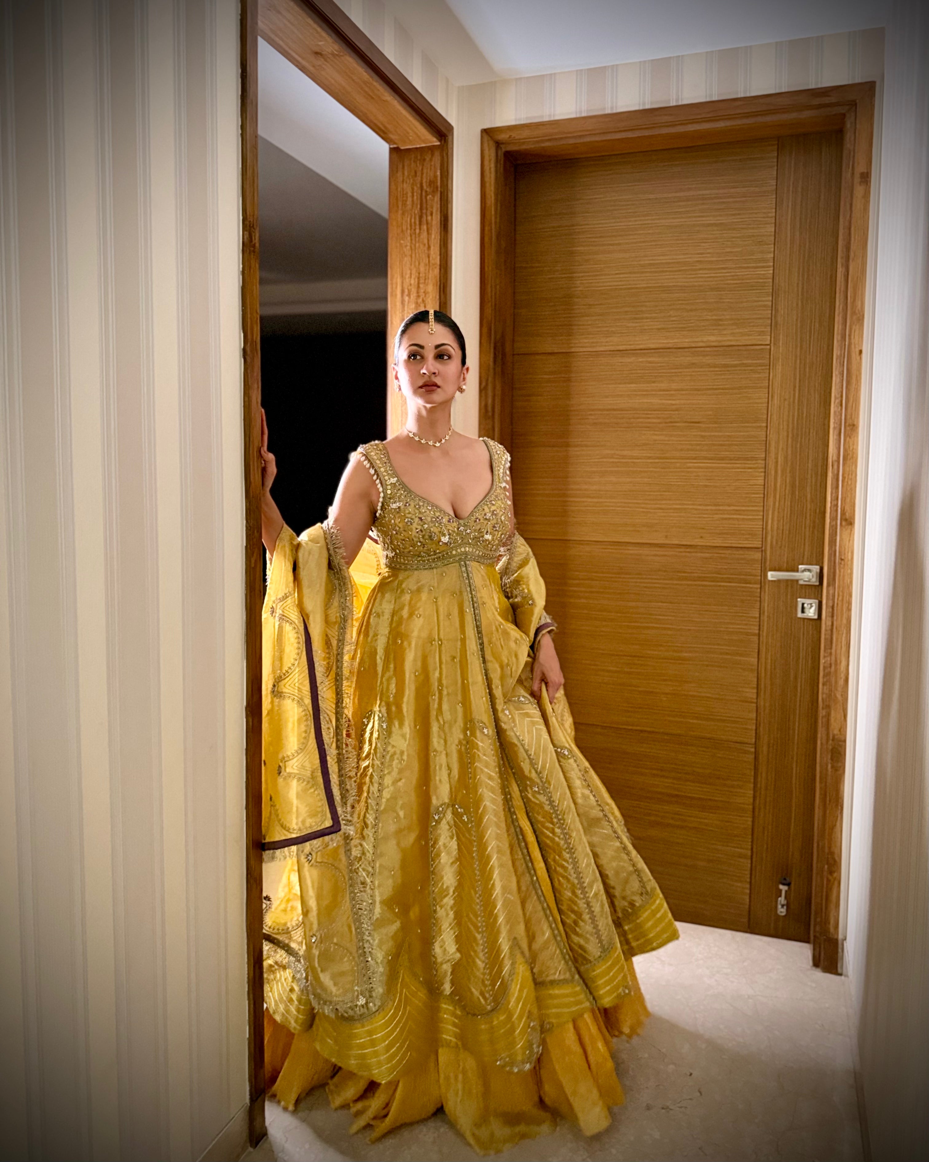 Sukhneett Wadhwa in our Mustard yellow zari tissue jacket with crushed skirt set