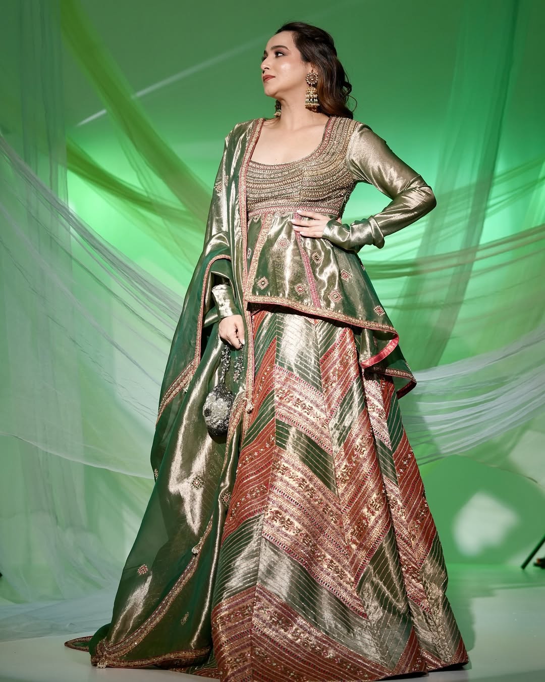 Kompal Matta Kapoor Emerald Green silk zari tissue peplum top with skirt and dupatta set