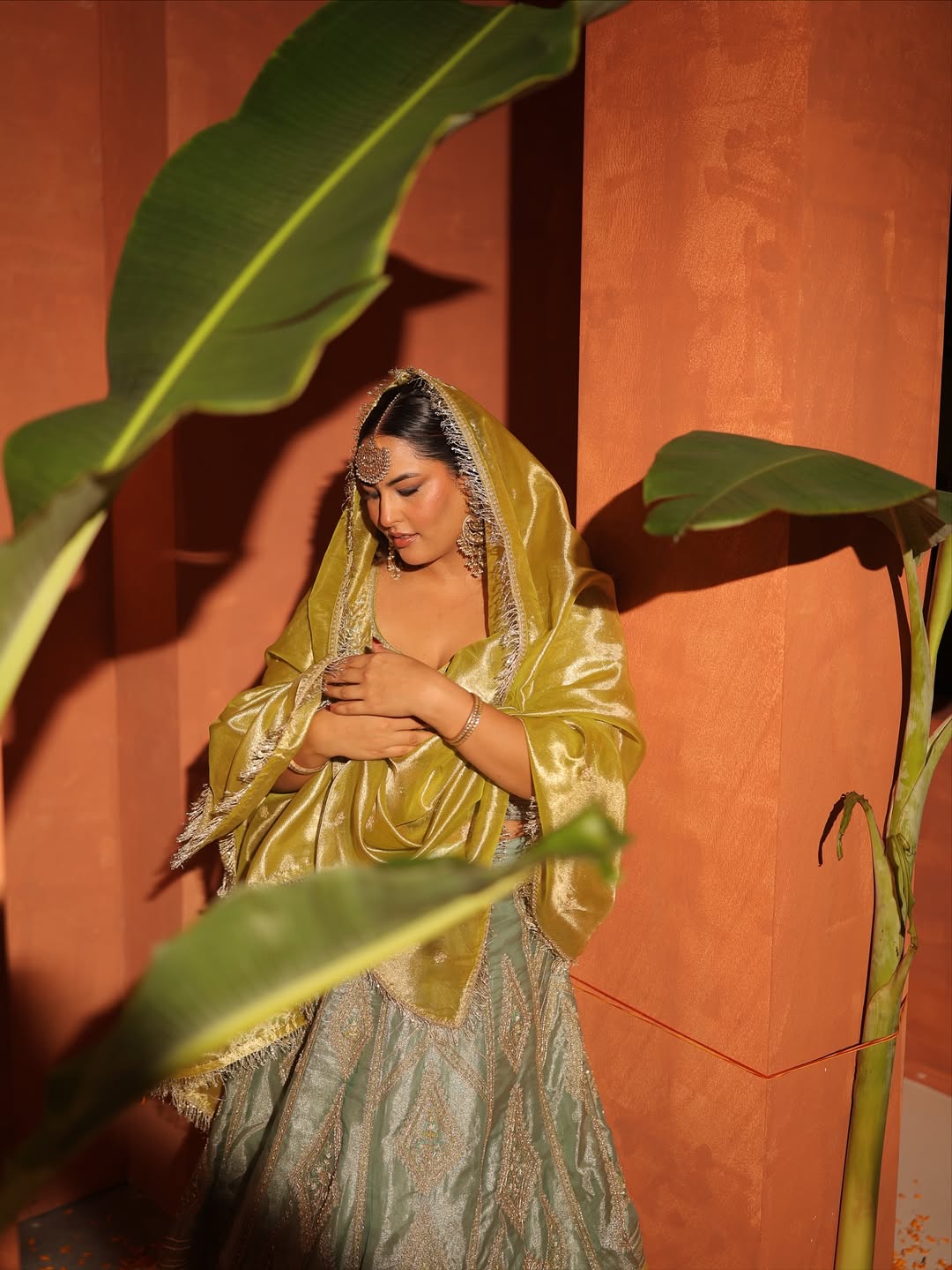 Sakshi Sindhvani in our Ice blue silk zari tissue lehenga with olive bloom dupatta