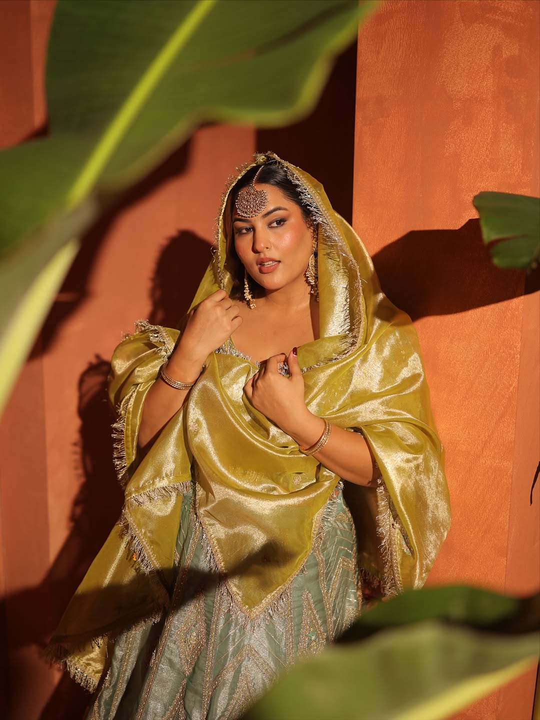 Sakshi Sindhvani in our Ice blue silk zari tissue lehenga with olive bloom dupatta