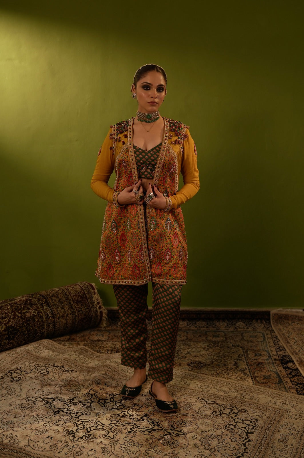 Green pants with blouse and mustard yellow jamawar jacket