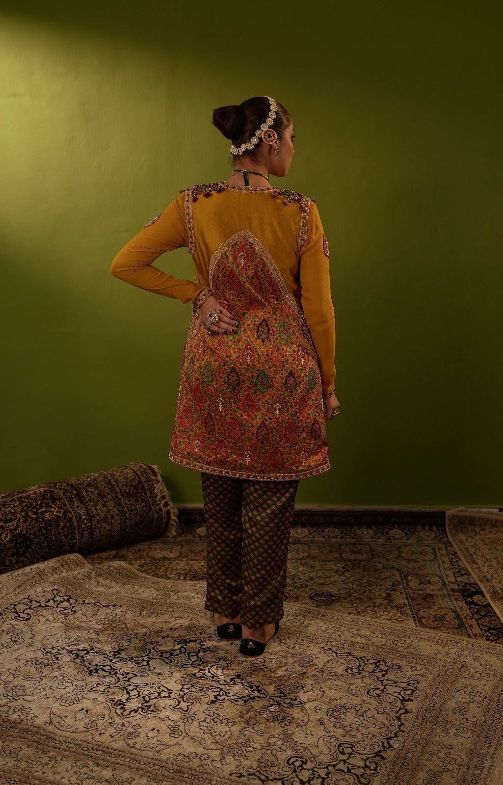 Green pants with blouse and mustard yellow jamawar jacket