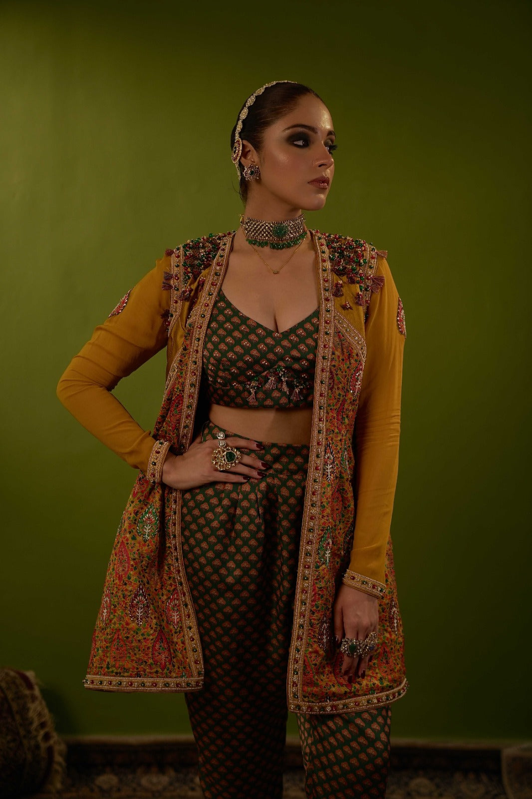 Green pants with blouse and mustard yellow jamawar jacket